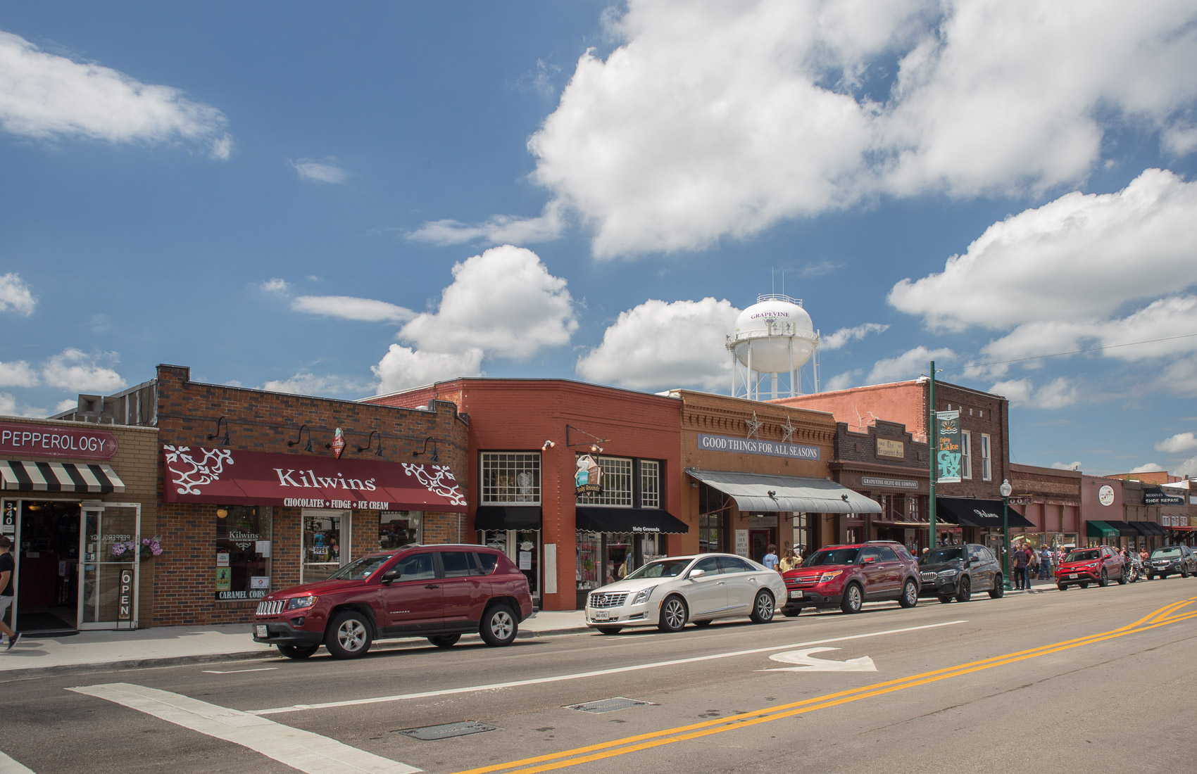 Historic Grapevine storefronts and the town water tower, May 2021